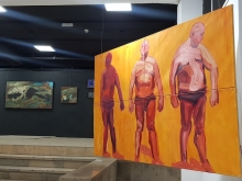 "Park sunbathing" versus the Professor's paintings. Photo by MK.